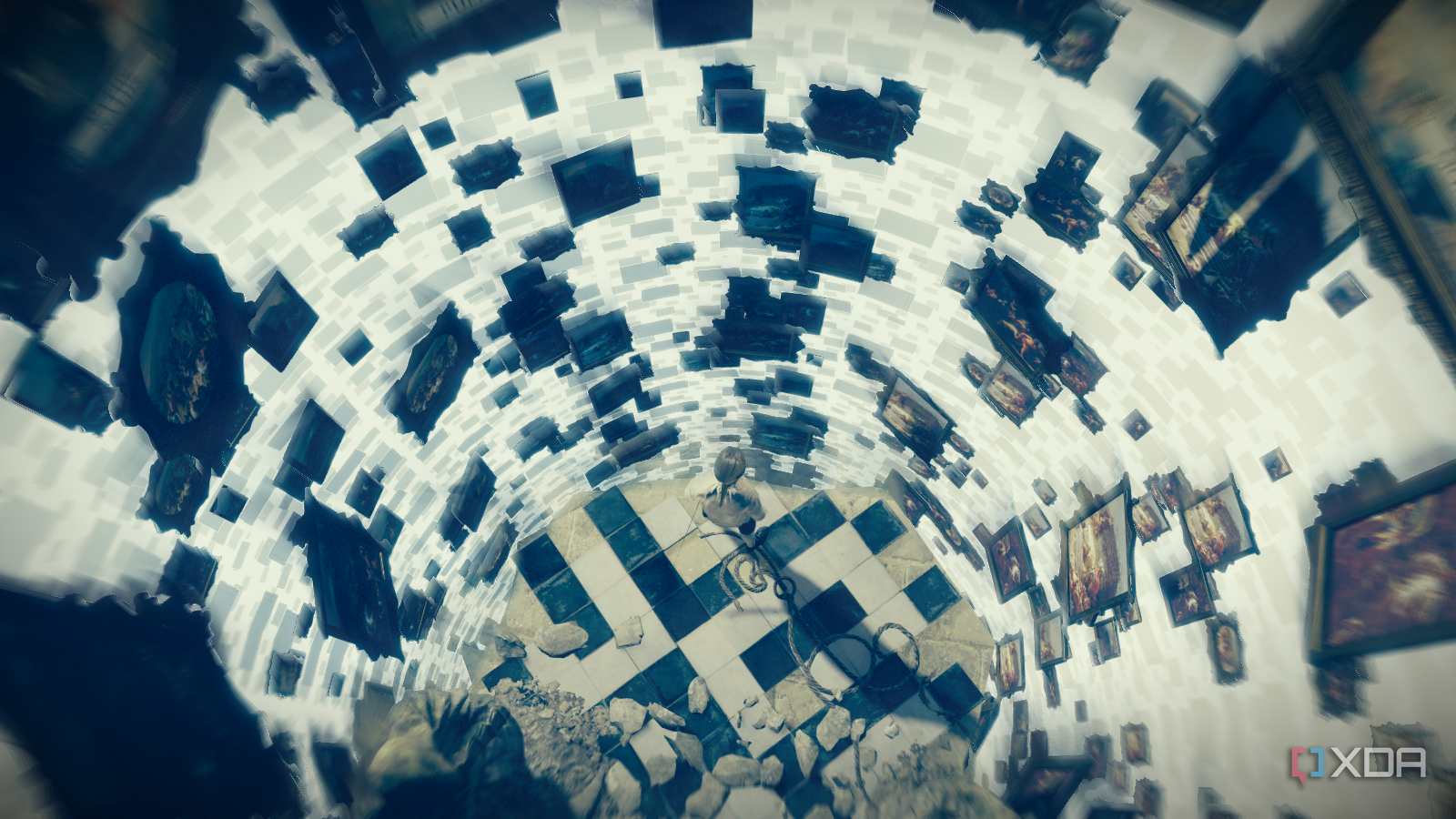 Top view of Arno looking down at a spiral of floating framed paintings in his Initiation hallucination sequence