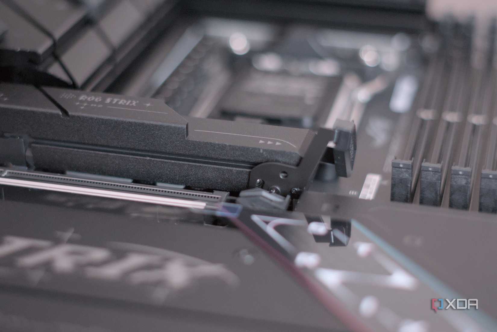 A close-up image of an Asus gaming motherboard.