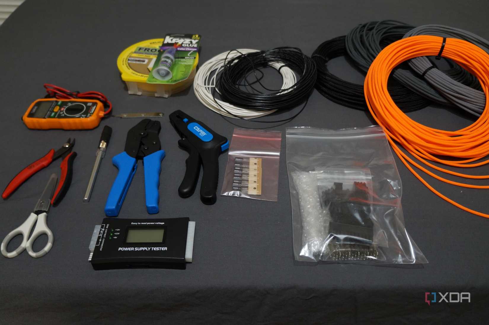 cable sleeving tools and supplies on a desktop