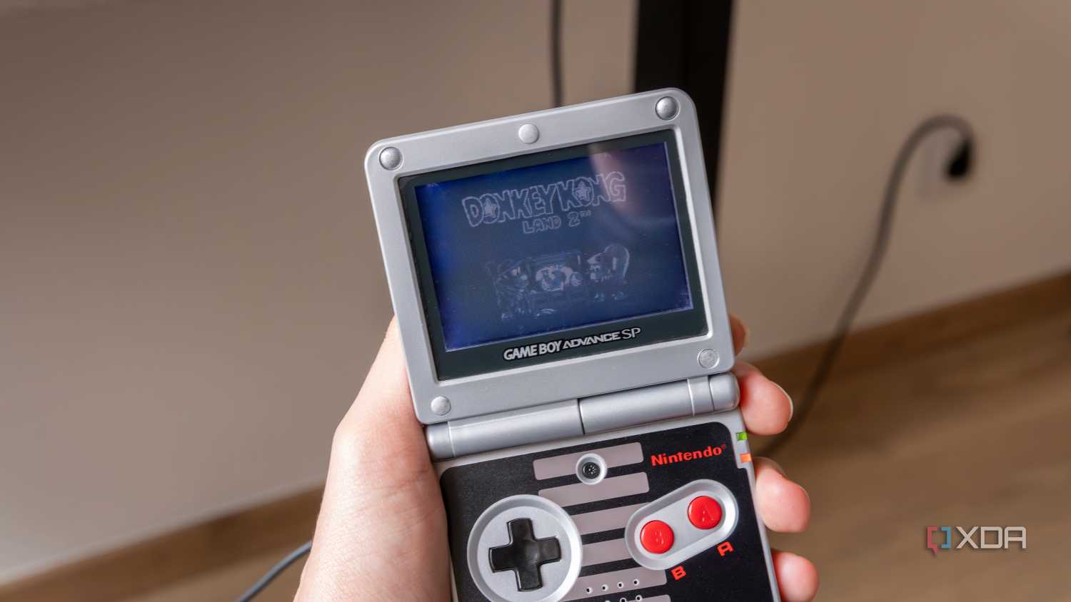 A Game Boy Advance SP playing Donkey Kong Land 2
