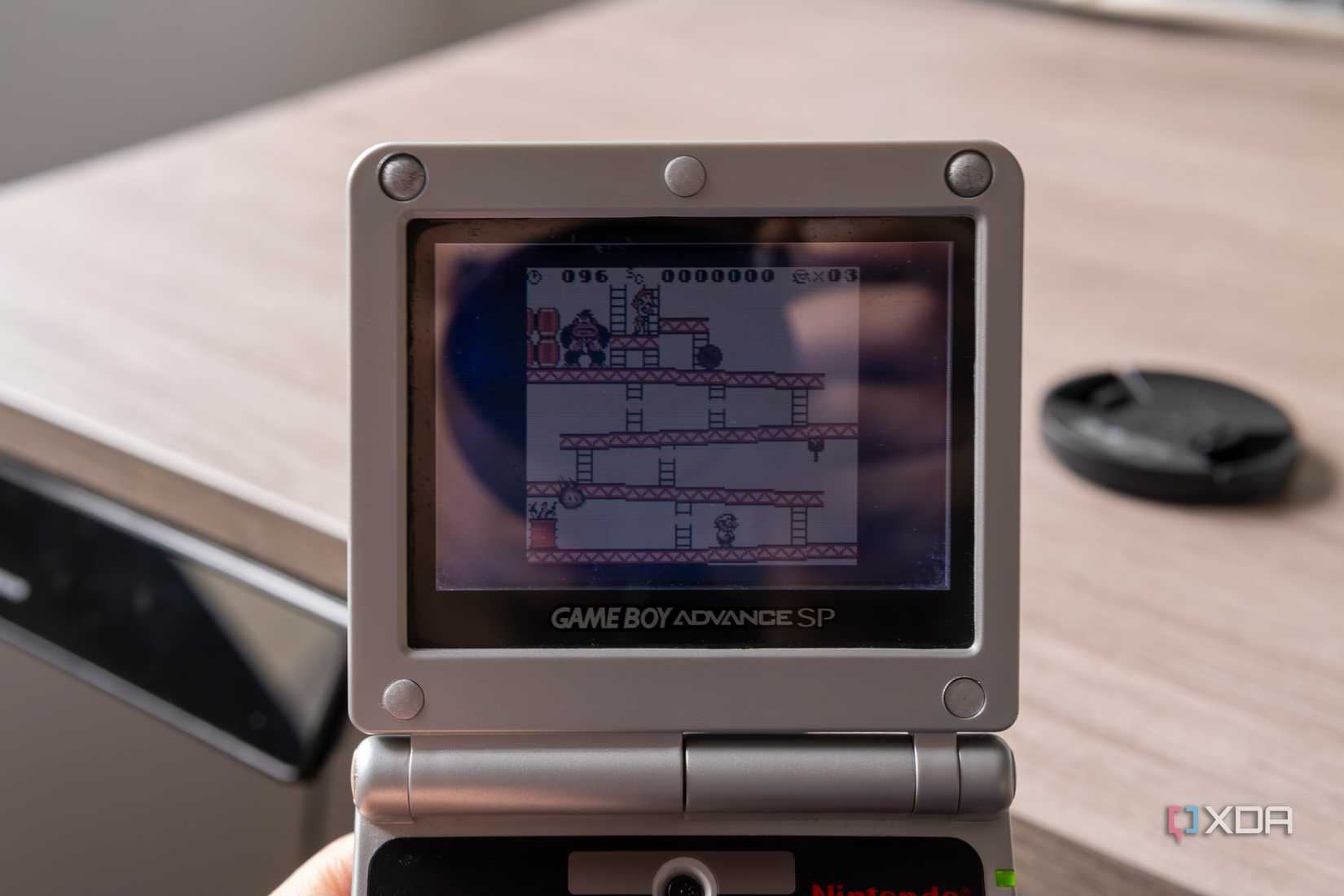 A Game Boy Advance SP running Donkey Kong for the Game Boy