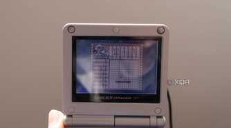 A Game Boy Advance SP playing the Game Boy game Mario's picross