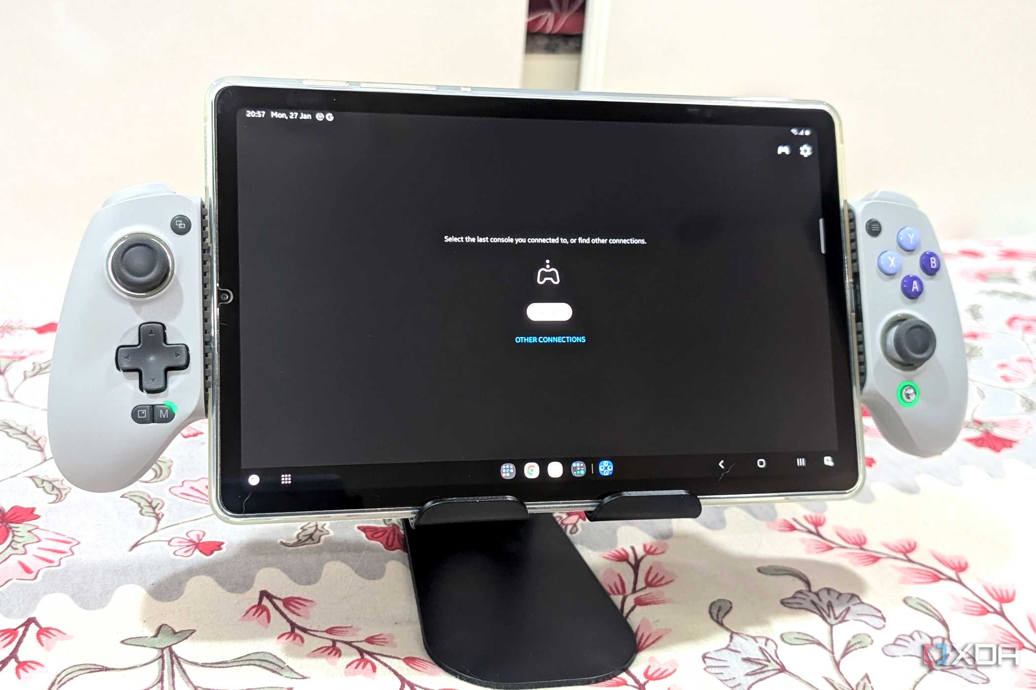 An image of an extended Gamesir Galileo G8 holding a Samsung S6 Lite Tablet.
