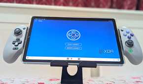 An extended grey Gamesir Galileo G8 controller holding a Samsung S6 Lite Tablet, with the app PX Play running on it.