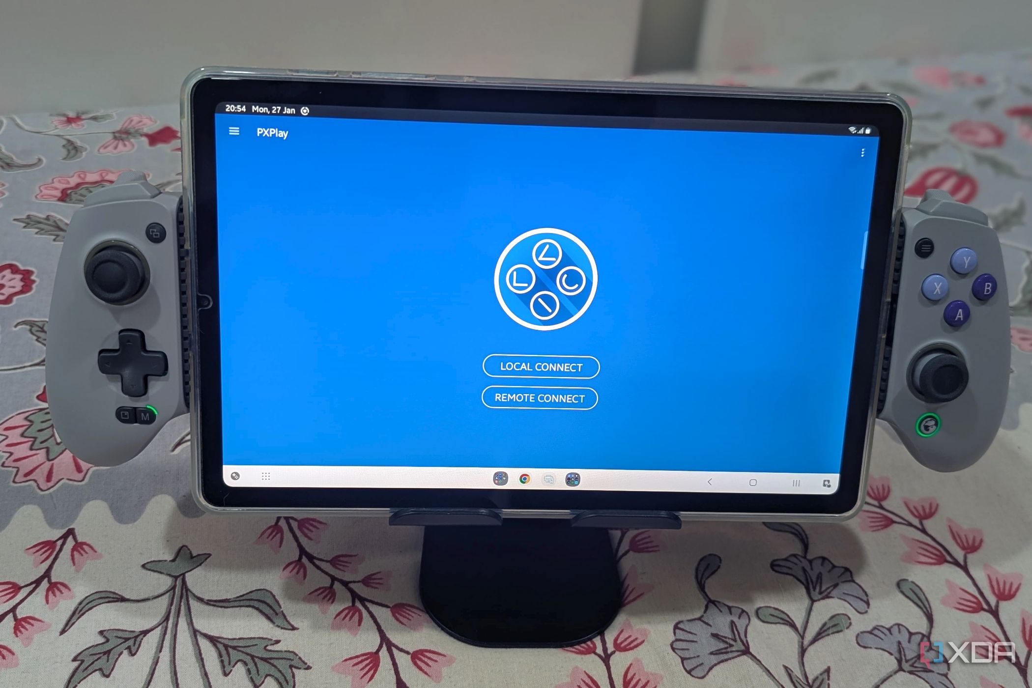 A Samsung Galaxy S6 Lite Tablet installed on a Gamesir Galileo G8 mobile gaming controller, with the Px Play app running on it.