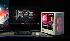 A white Omen-brand gaming PC on a dark desk with black peripherals