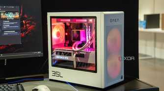 A white PC case with a mesh front and clear side panel showing well-illuminated components