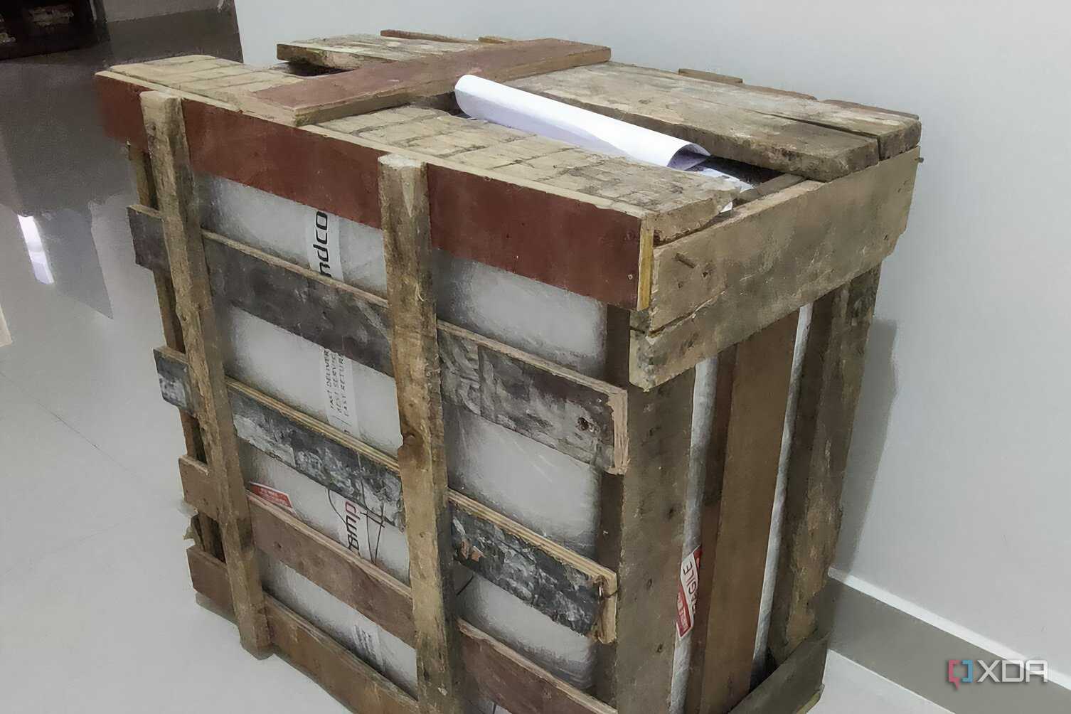 A gaming PC inside a wooden crate