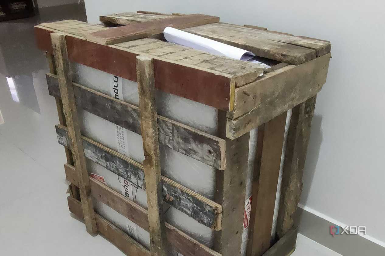 A gaming PC inside a wooden crate