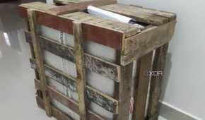 A gaming PC inside a wooden crate