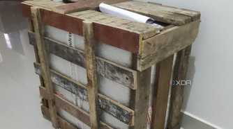 A gaming PC inside a wooden crate