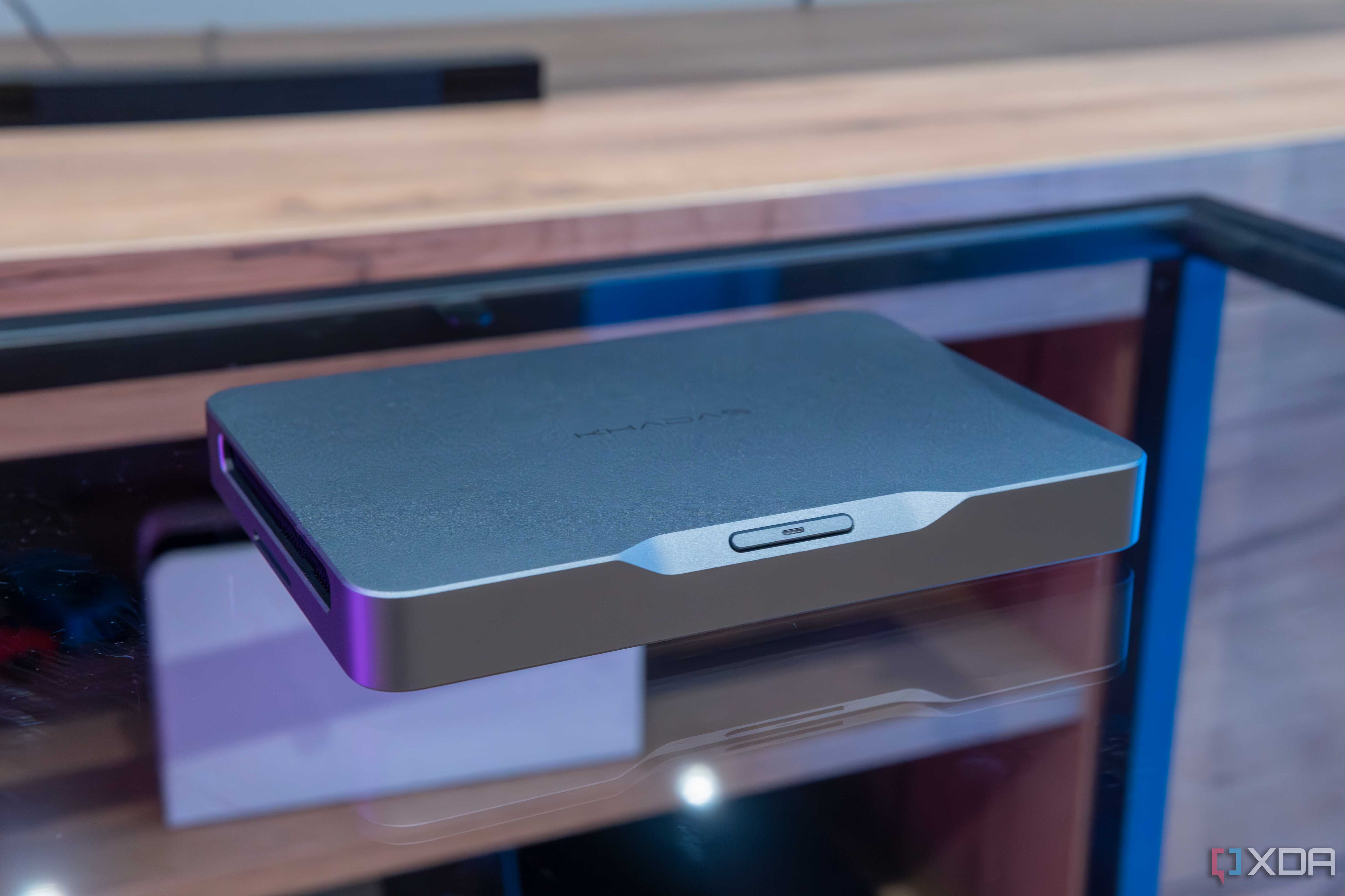 Angled view of the Khadas Mind AI Dev Kit on a glass table