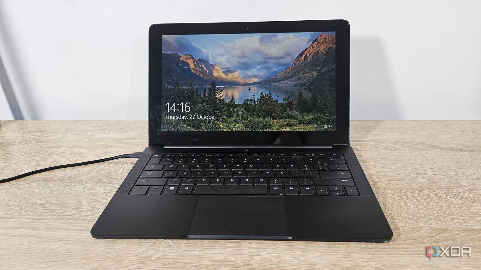 an old razer blade stealth laptop on a desk
