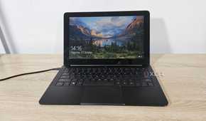 an old razer blade stealth laptop on a desk