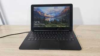 an old razer blade stealth laptop on a desk