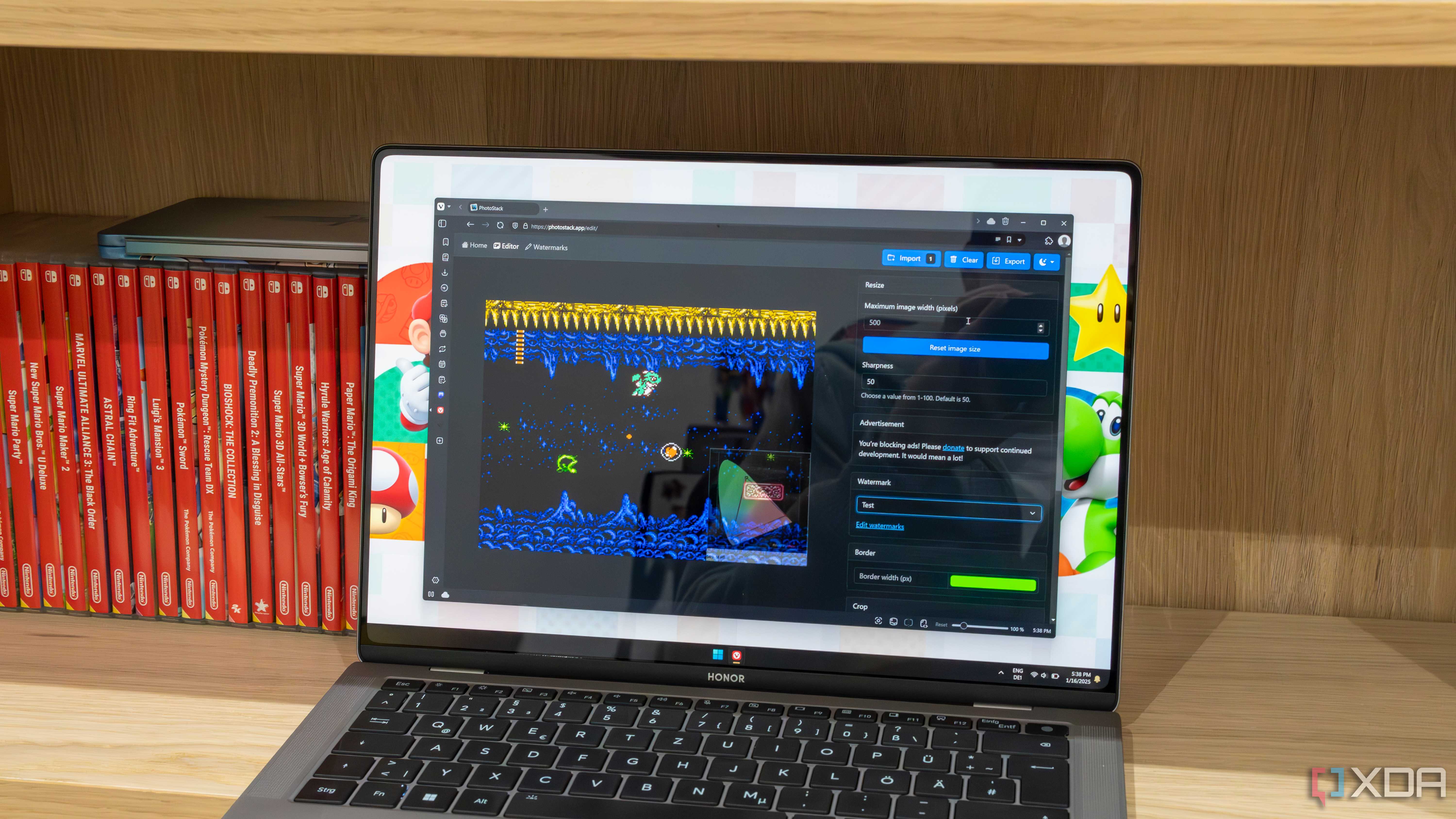 A Windows 11 laptop running PhotoStack in the Vivaldi browser