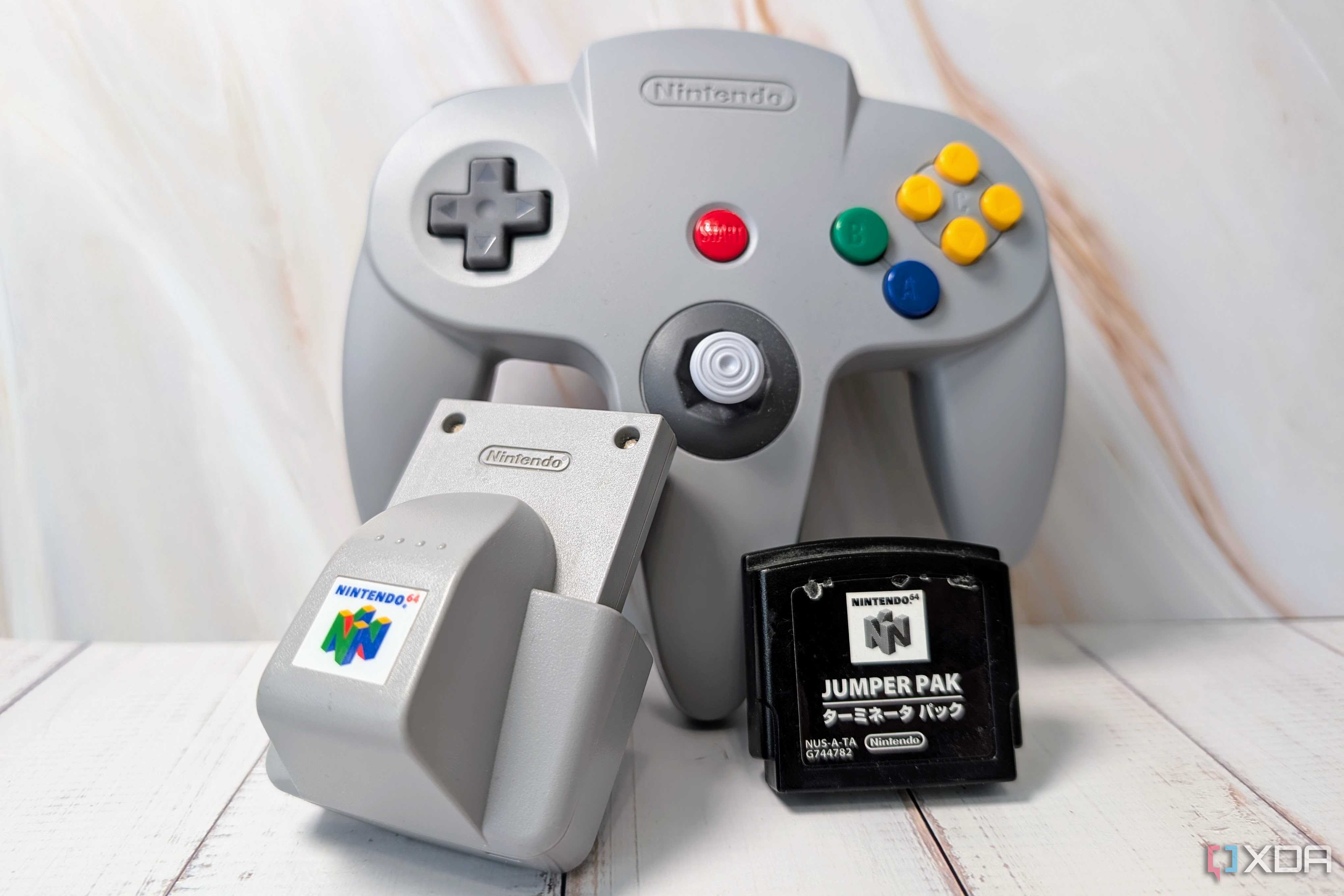 Nintendo 64 contoller with rumble pak and jumper pak