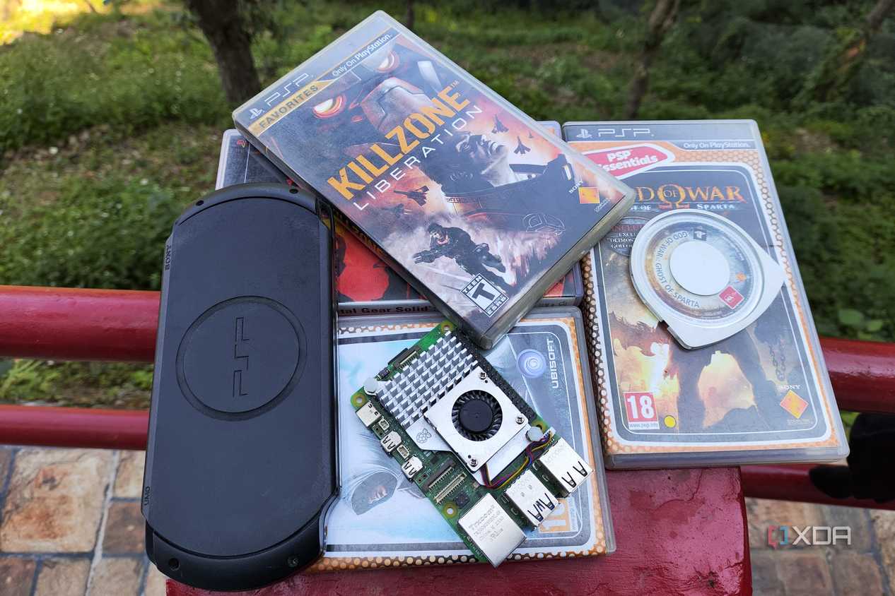A Raspberry Pi placed near a PSP and some UMDs