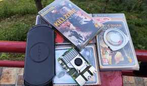 A Raspberry Pi placed near a PSP and some UMDs