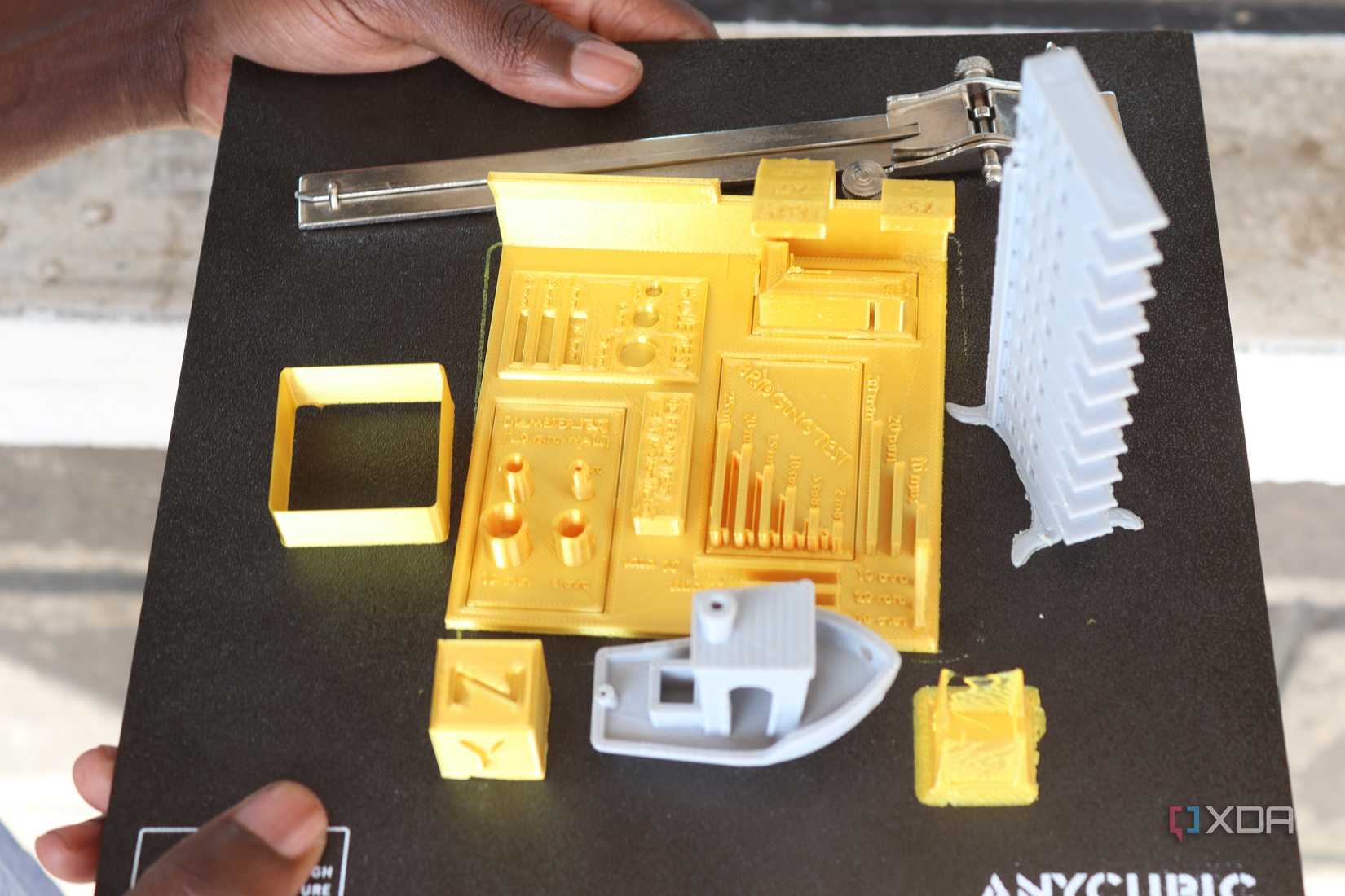 3D printed models on top of a 3D printer bed