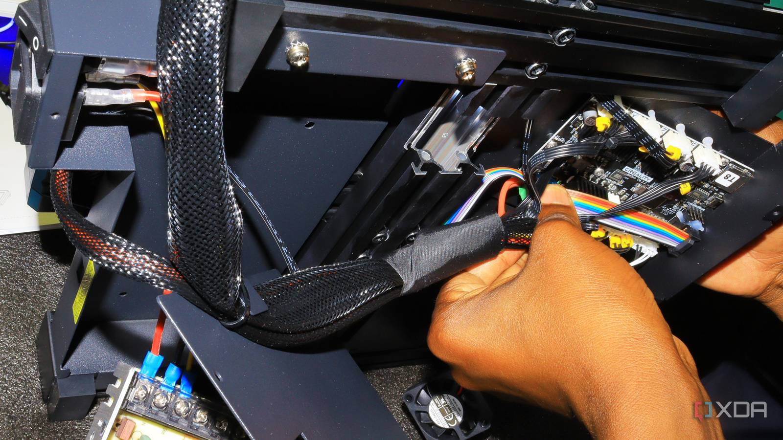 Inserting wires on a motherboard of a 3D printer
