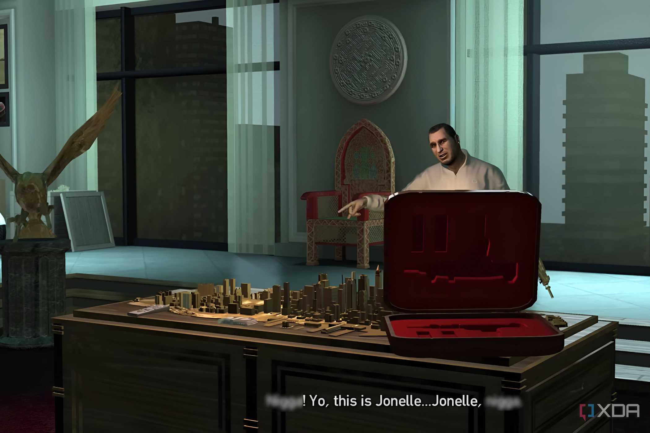 A screenshot from GTA IV: The Ballad of Gay Tony, showing a man celebrating joyously behind a table strewn with blueprints.