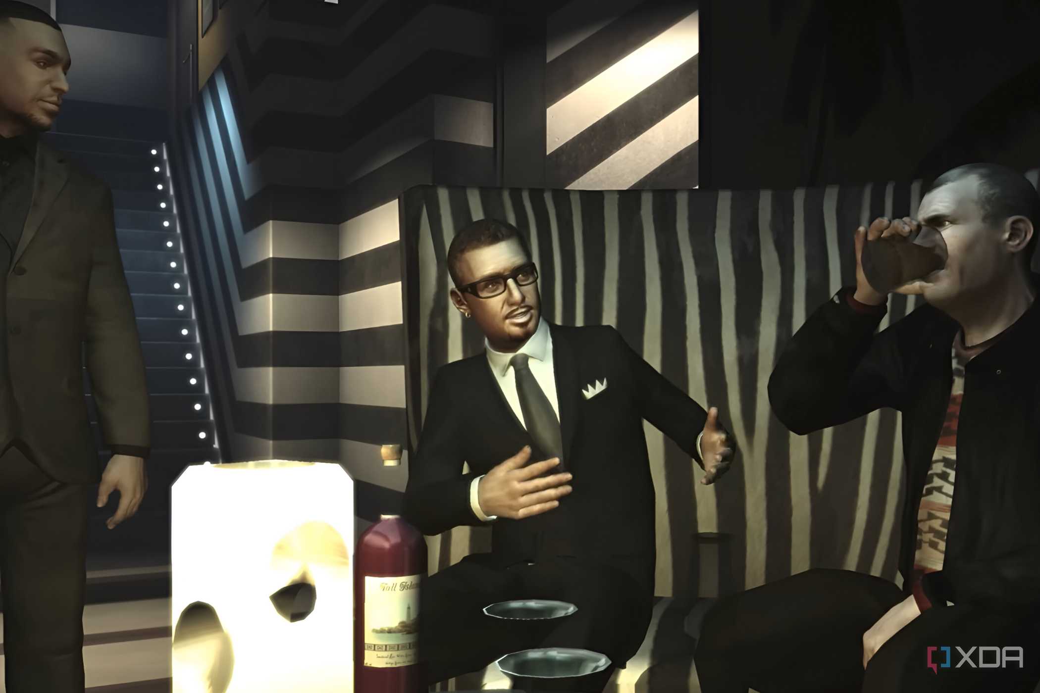 A screenshot from GTA IV: The Ballad of Gay Tony, showing three characters in suits conversing in a club.