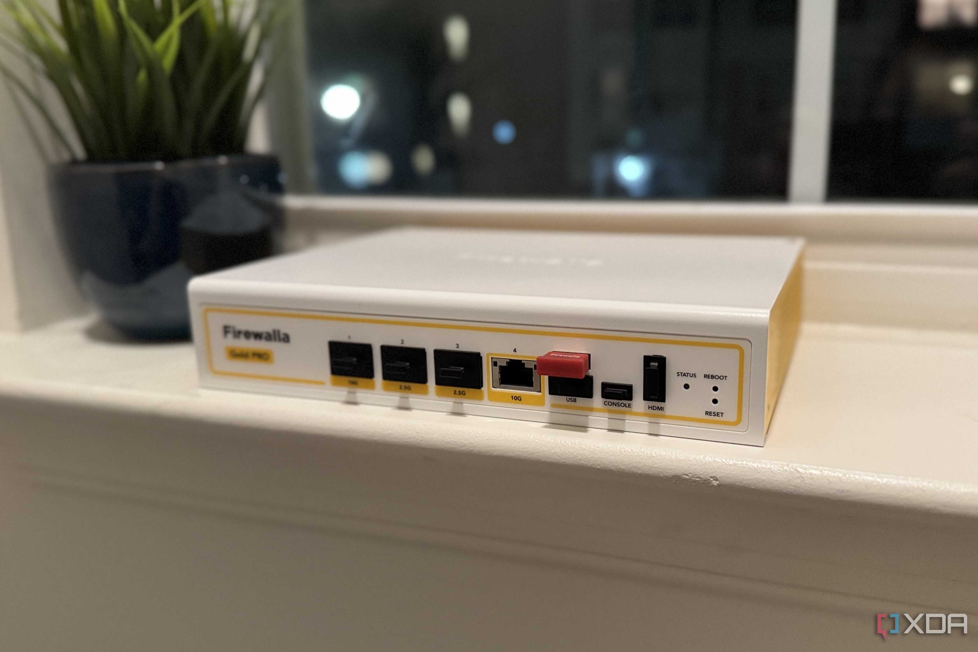 firewalla gold pro hardware firewall on a windowsill