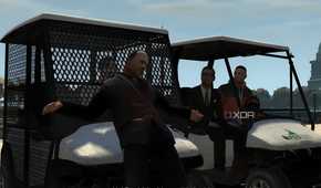 A screenshot from GTA IV: The Ballad of Gay Tony, showing two golf carts with a man bound to the front of one.