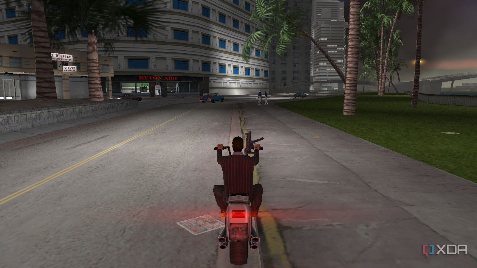 Tommy riding a bike in Port Island across from a drug store
