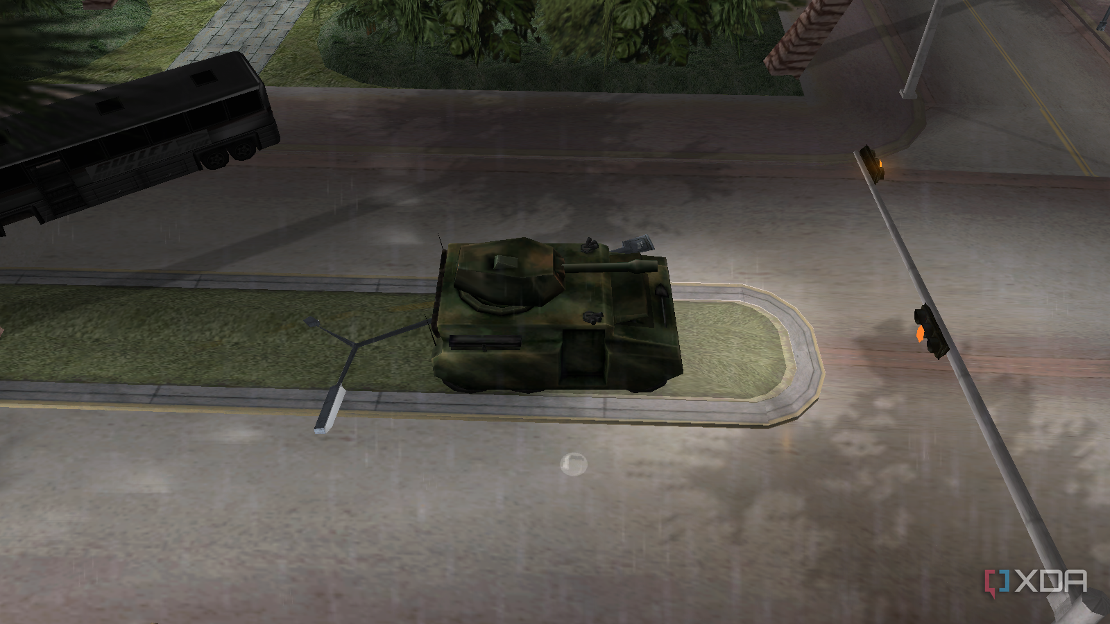 A tank driving past a destroyed bus and causing mayhem in the street