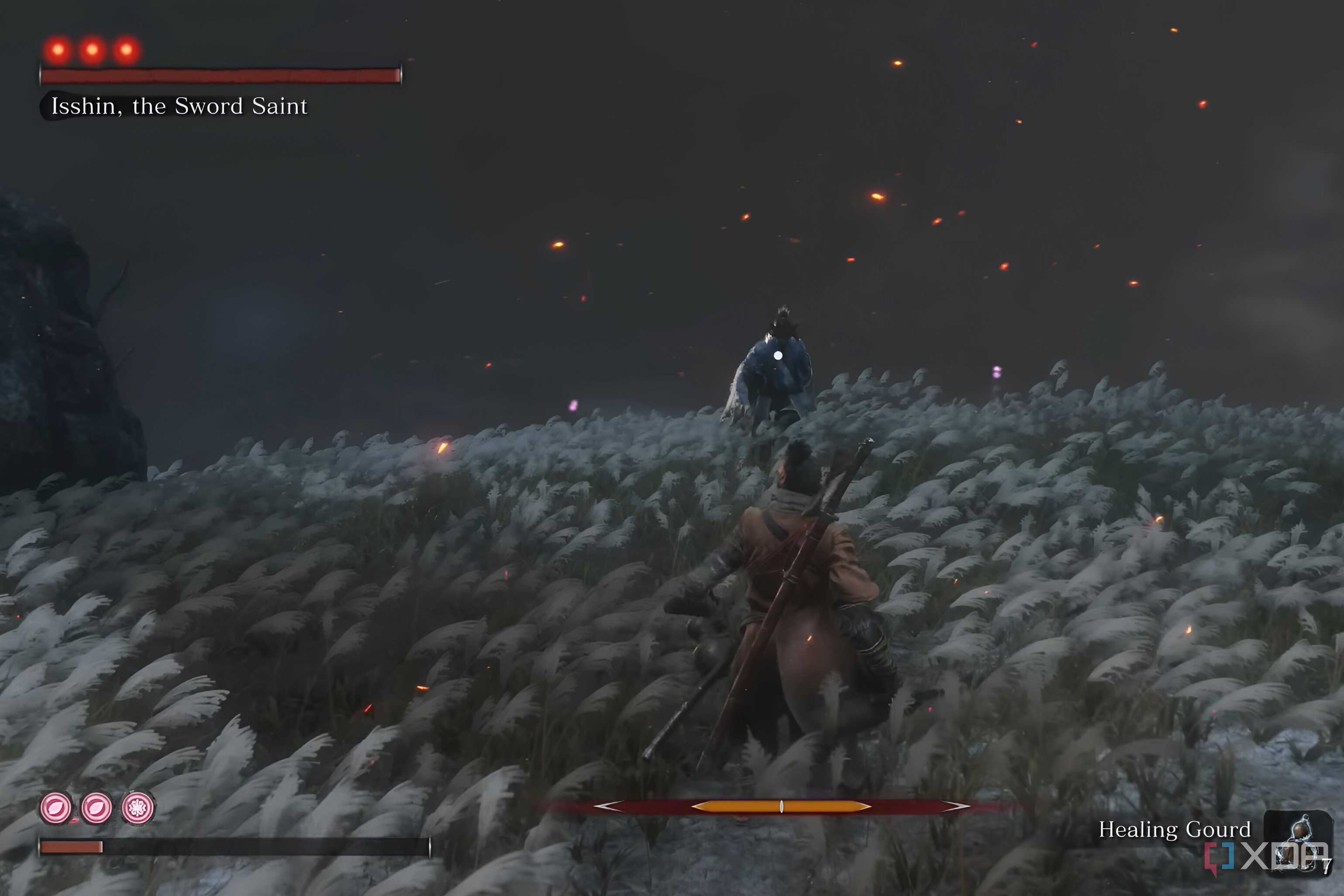 An image from the game Sekiro: Shadows Die Twice, showing Sekiro in red, fight Isshin draped in blue.