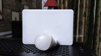 A bulb and an LED resting on top of a PC case