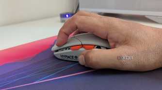 A person holding a gaming mouse in a claw grip