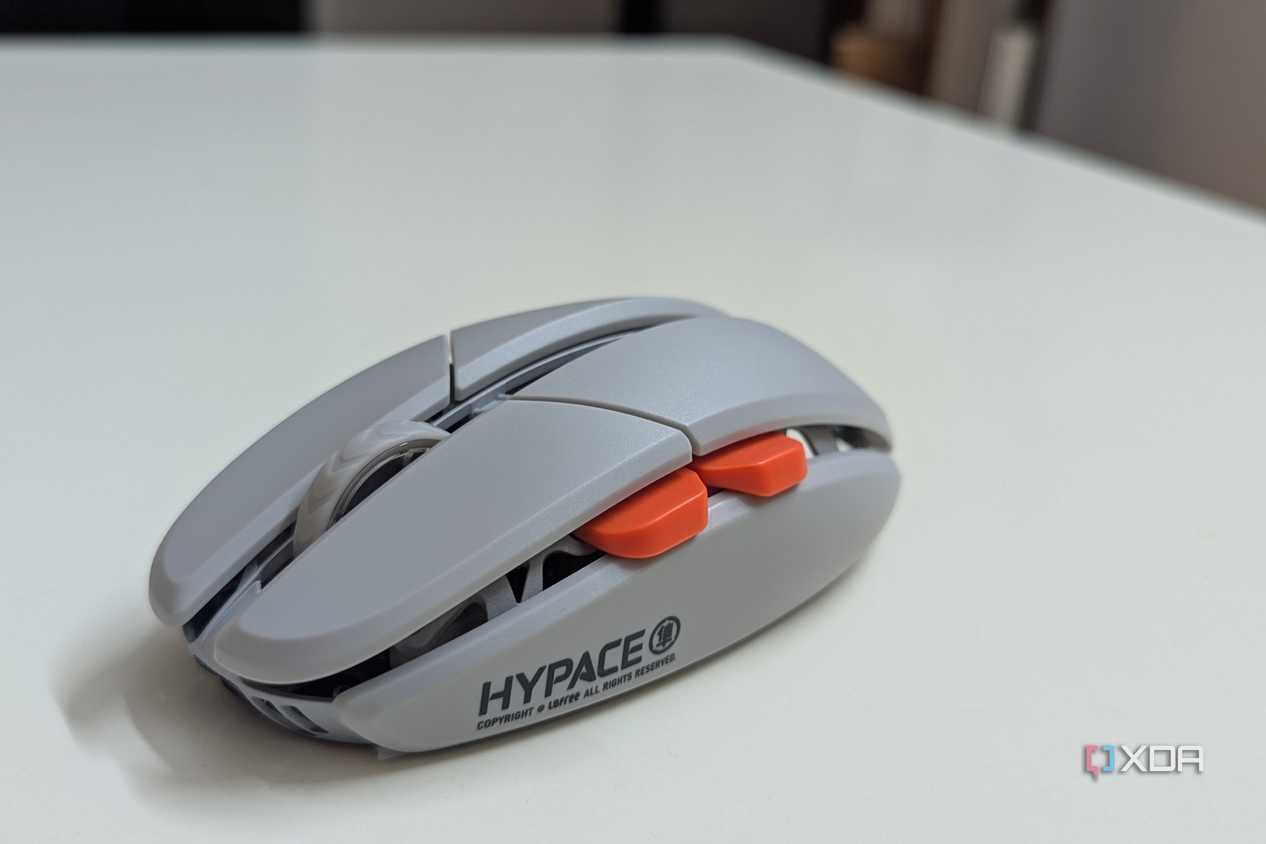 Side view of a gaming mouse showing the side buttons and scroll wheel