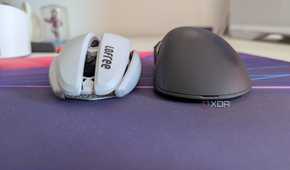 A white and black gaming mouse side by side