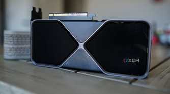 The RTX 5070 graphics card sitting on a table with the fans facing outward.