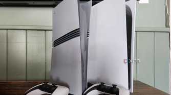 PlayStation 5 consoles on table with controllers