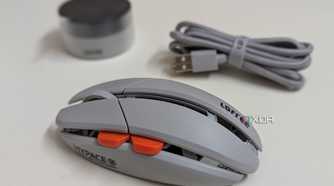 Side view of a gaming mouse with a wireless dongle and USB cable