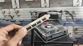 Holding a USB expansion card in front of the Radxa Orion O6