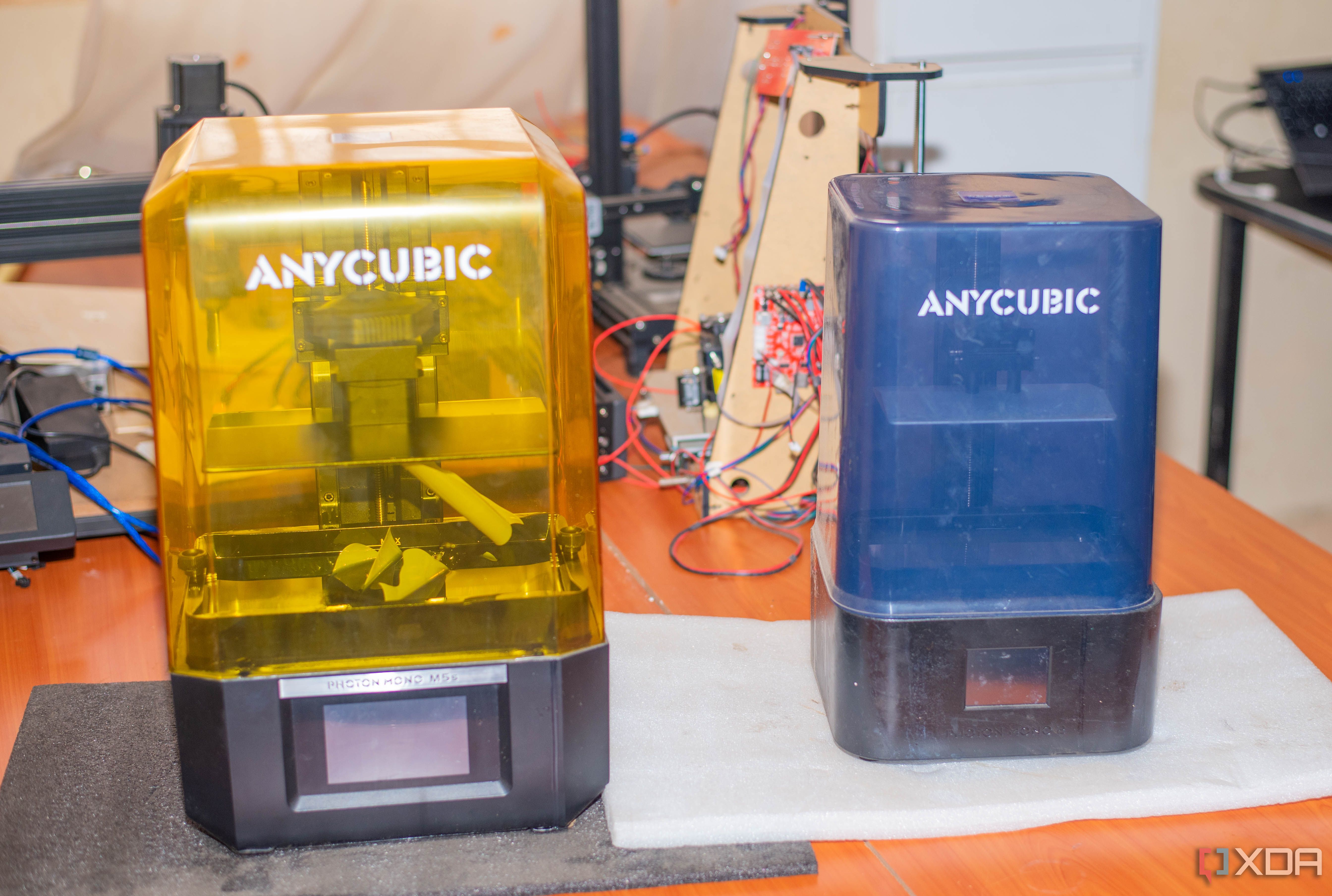 Two anycubic resin 3D printers on a table