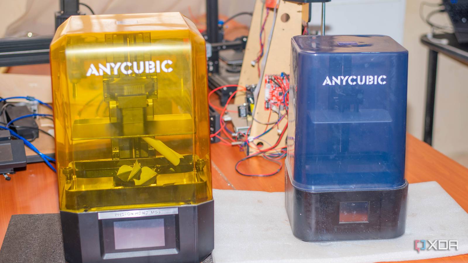 Two anycubic resin 3D printers on a table