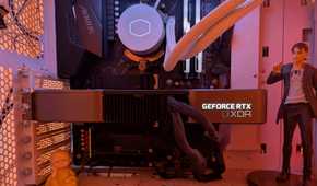 Inside of a gaming PC showing an RTX 3080 next to some figurines