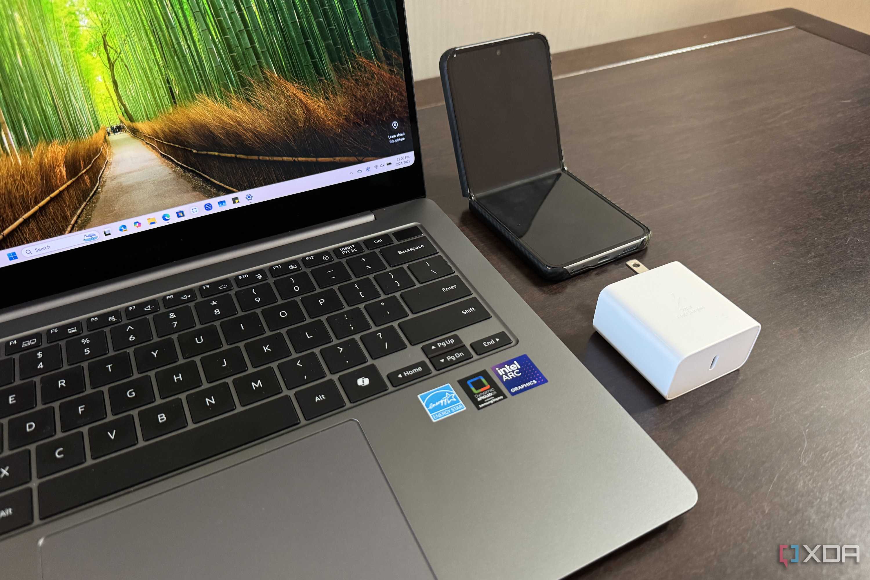 samsung galaxy book 5 pro with charger and z flip 5 next to it