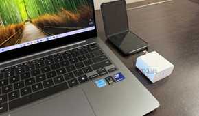 samsung galaxy book 5 pro with charger and z flip 5 next to it