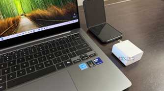 samsung galaxy book 5 pro with charger and z flip 5 next to it