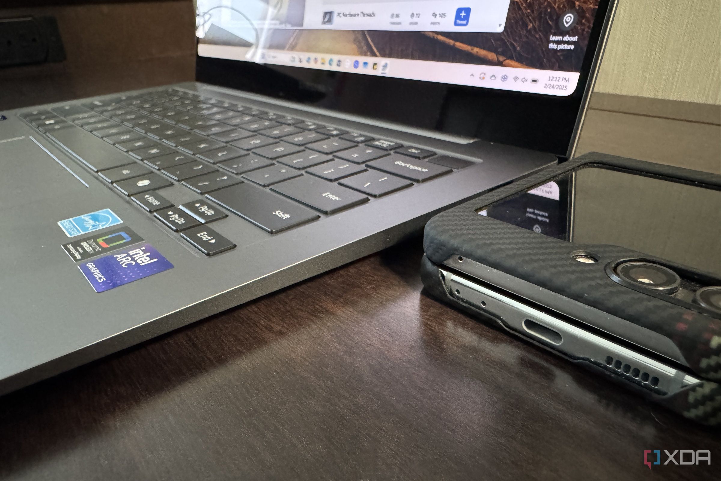 samsung galaxy book 5 pro with galaxy z flip 5 next to it