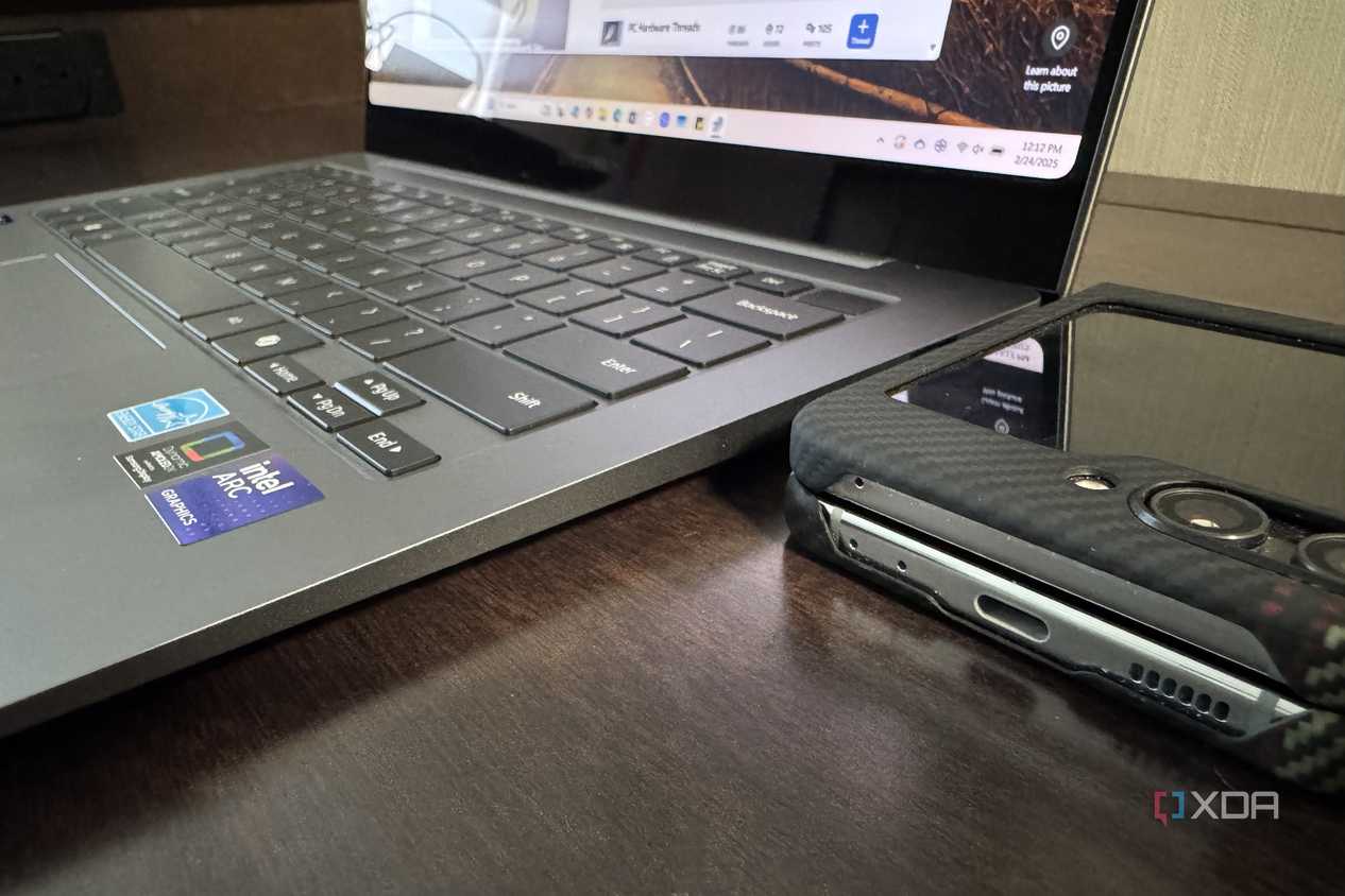 samsung galaxy book 5 pro with galaxy z flip 5 next to it