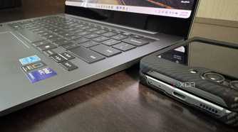 samsung galaxy book 5 pro with galaxy z flip 5 next to it