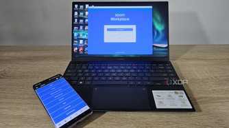 unified remote app on smartphone with laptop showing zoom